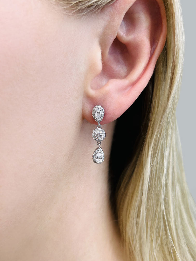 Dazzling Pear And Round Diamond Drop Earrings